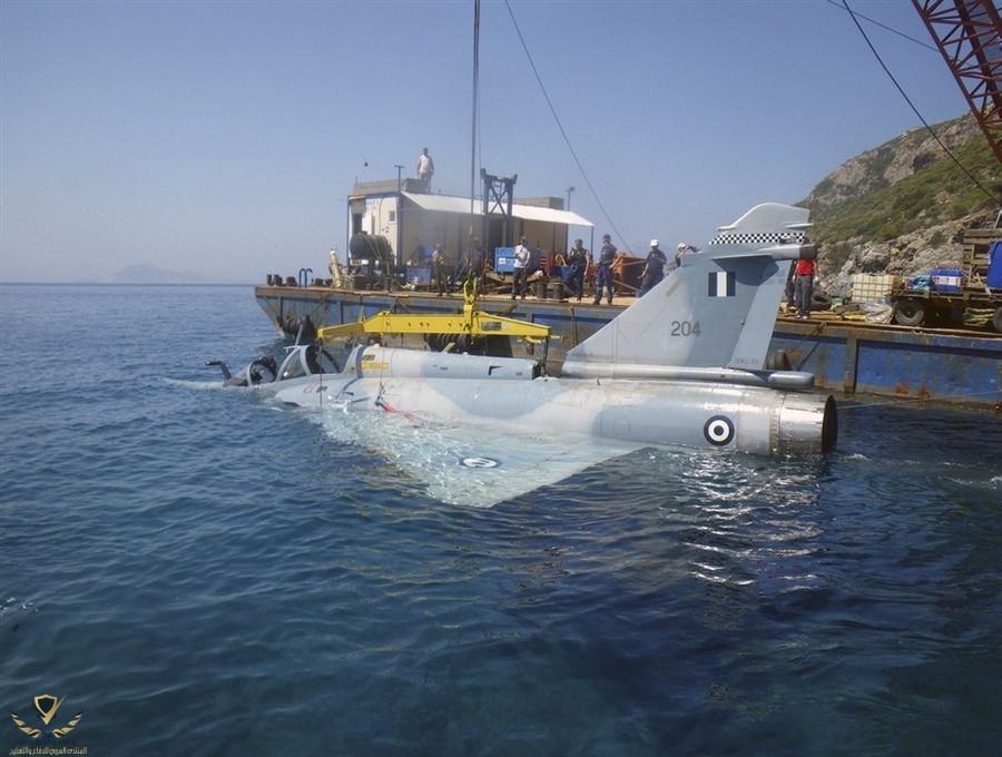 A Greek Air Force Mirage 2000 fighter jet is lifted from the Aegean sea near the Greek island...jpeg