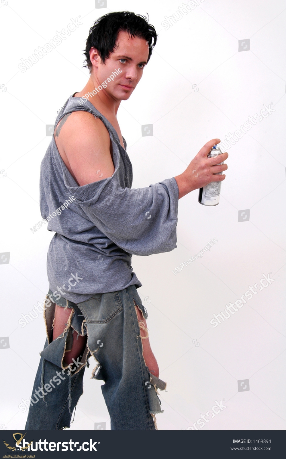 stock-photo-a-vandal-in-torn-clothing-about-to-spray-paint-a-wall-1468894.jpg