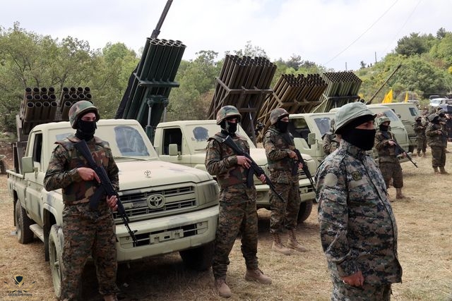 lebanese-hezbollah-fighters-stand-near-multiple-rocket-news-photo-1697645435.jpg