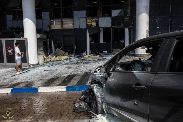 man-inspects-the-damage-at-a-supermarket-after-it-was-hit-news-photo-1697645602.jpg