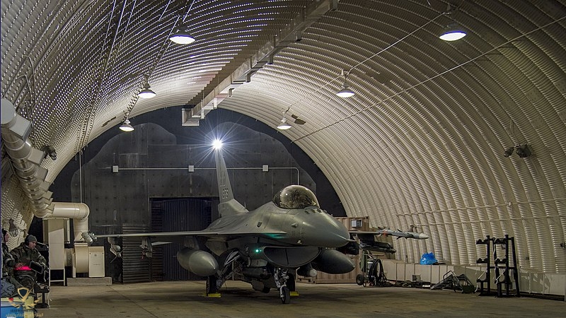 800px-US_Female_F-16_Fighter_Pilot_Capt_Brittany_Trimble_waits_to_taxi_out_her_hardened_aircra...jpg