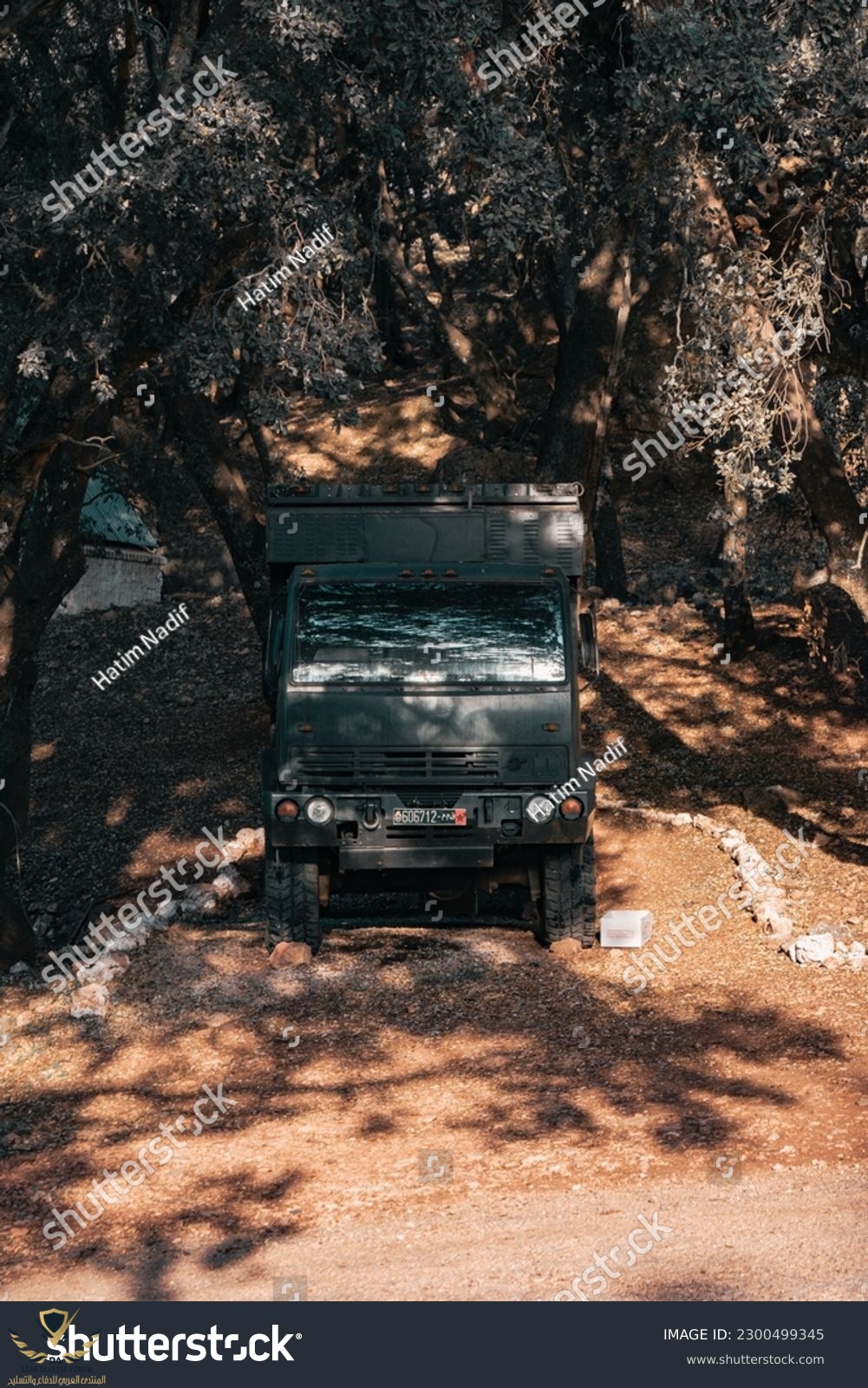 stock-photo-morocco-azrou-april-a-black-big-military-caravan-parked-into-the-forest-april-2300...jpg