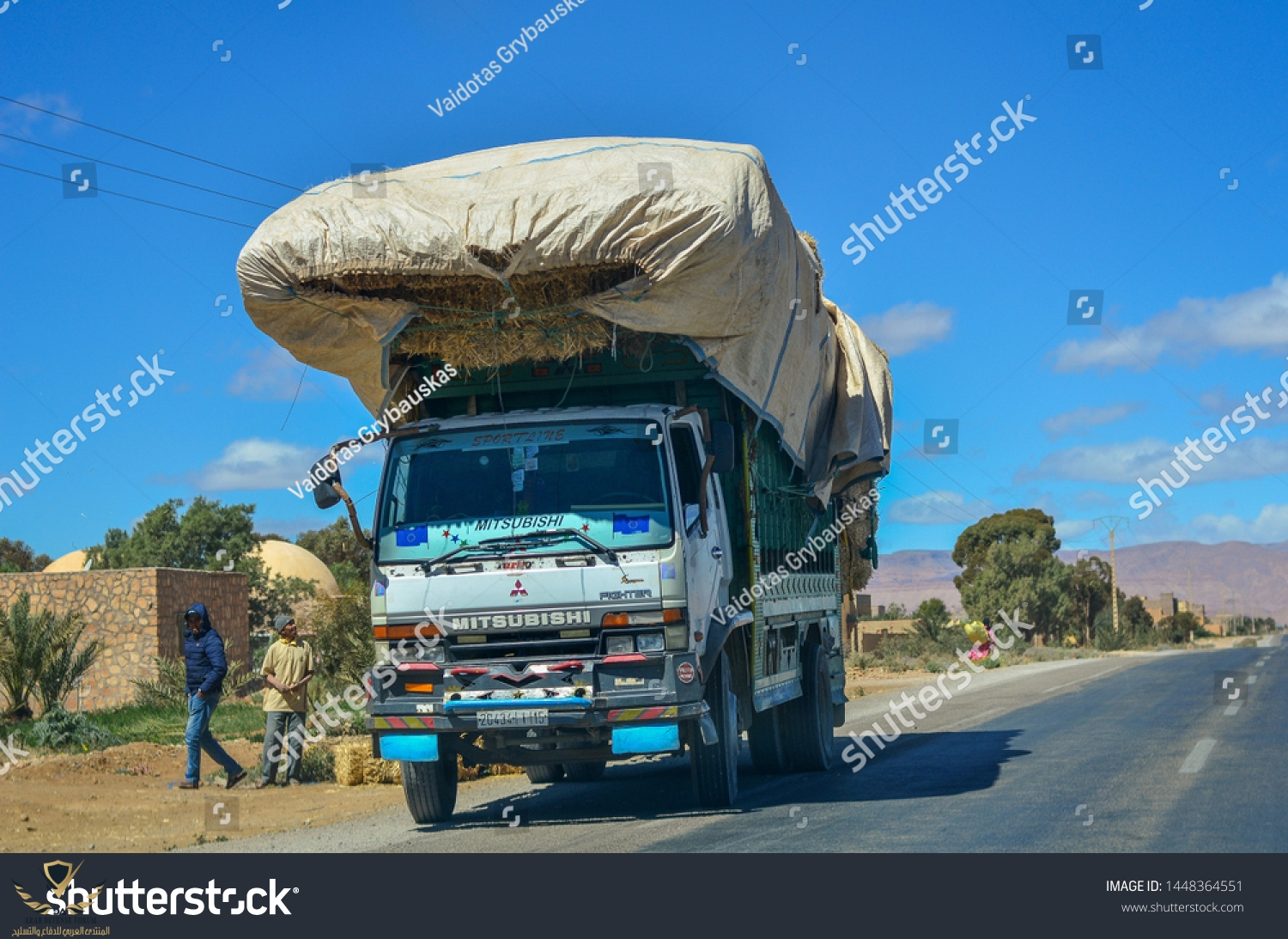 stock-photo-midelt-morocco-march-a-mitsubishi-fighter-truck-loaded-with-huge-cargo-standing-on...jpg