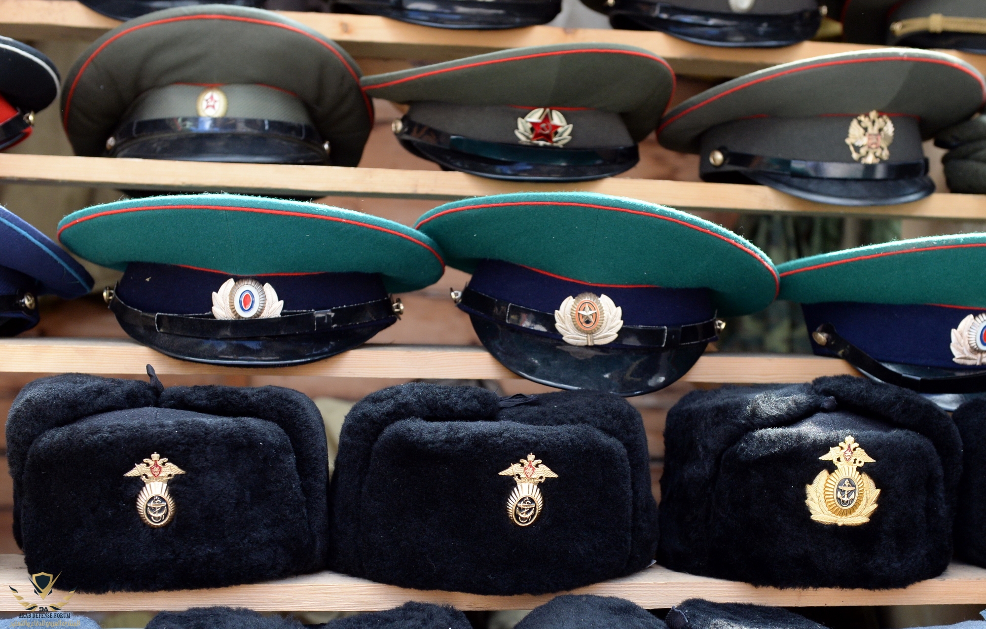 Military-caps-with-Soviet-cockades-laid-out-on-a-souvenir-counter-in-the-city-of-Moscow.jpg