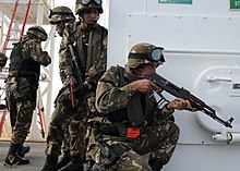 A_boarding_team_from_Algerian_navy_ship_Mourad_Rais_(F_901)_conducts_an_exercise_aboard_the_pr...jpg