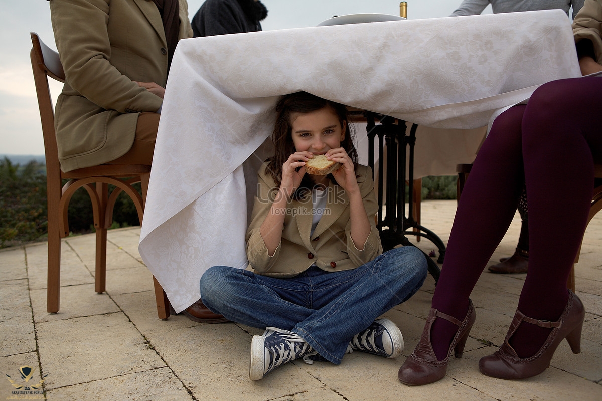 lovepik-girl-eating-bread-under-the-table-picture_501457442.jpg