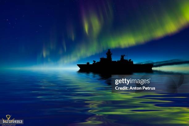 warship-at-sea-with-northern-lights-frigate-ship.jpg