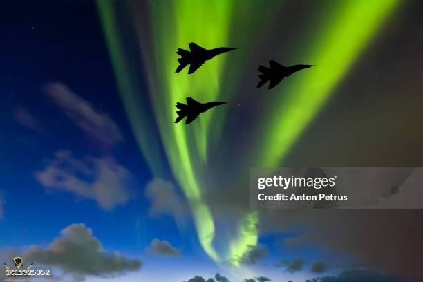 fighters-on-the-background-of-northern-lights.jpg