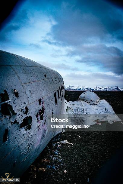 abandoned-military-airplane-at-beach-against-cloudy-sky-during-winter.jpg