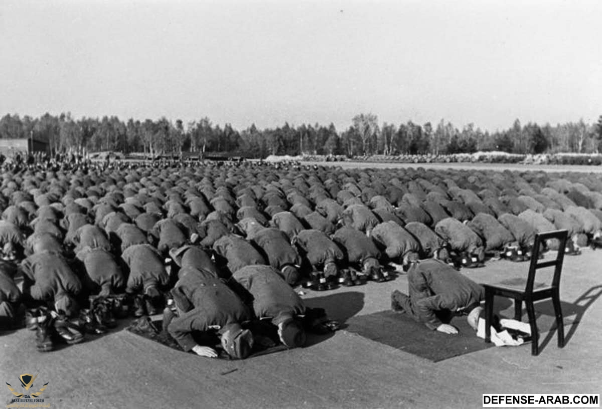 Muslim members of the Waffen-SS 13th division at prayer during their training in Germany,  1943.jpg