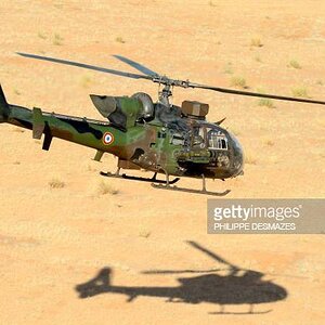 a-french-army-helicopter-gazelle-flies-over-the-desert-during-the-hydra-operation-on-october.jpg