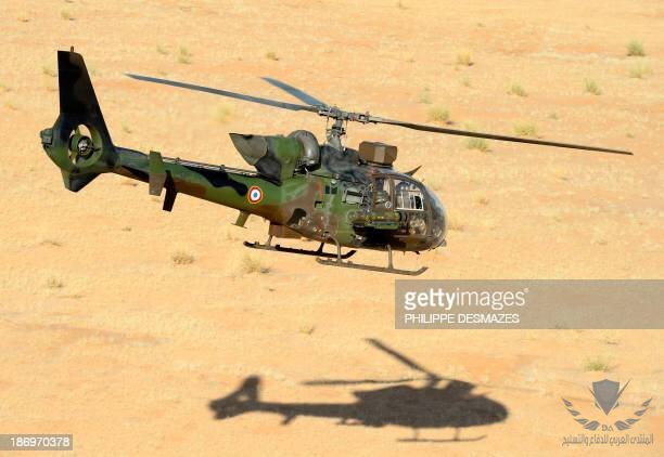 a-french-army-helicopter-gazelle-flies-over-the-desert-during-the-hydra-operation-on-october.jpg