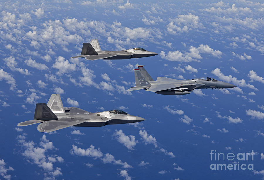 an-f-15-eagle-and-two-f-22-raptors-fly-high-g-productions.jpg