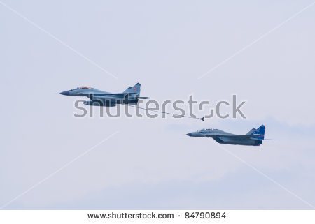 stock-photo-zhukovsky-russia-august-mig-and-mig-jet-fighters-demonstrate-mid-air-refueling-during-84790894.jpg