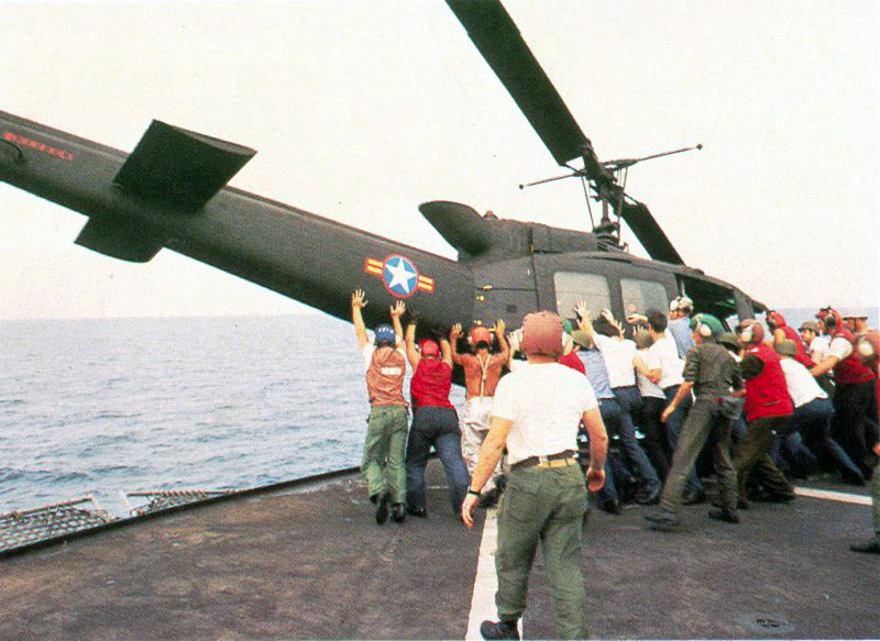 Vietnamese_UH-1_pushed_over_board,_Operation_Frequent_Wind.jpg