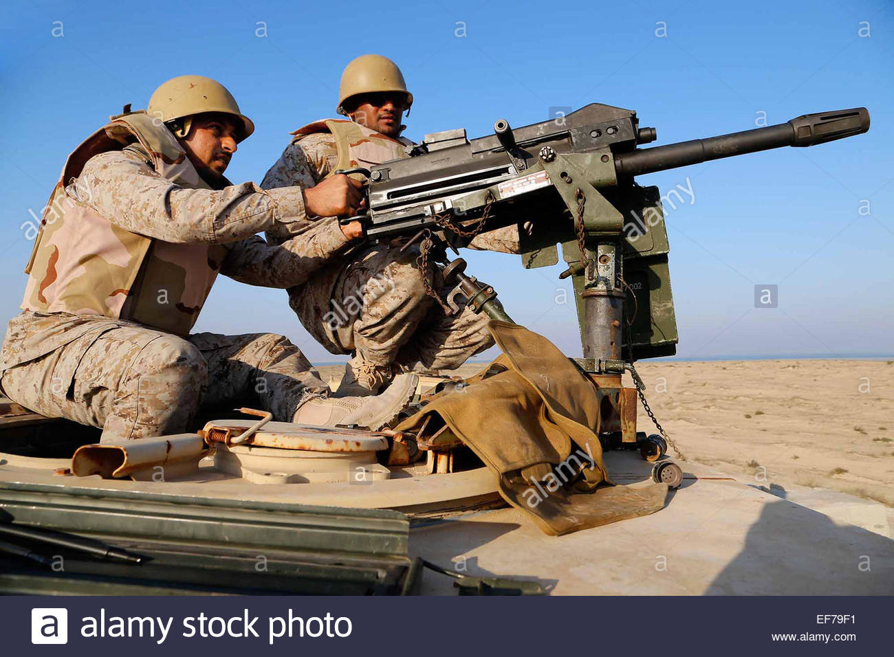 A Saudi Marine fires a Mk19 grenade launcher during a joint machine gun  live fire exercise with U.S. Marines as part of exercise Red Reef December  11, 2014 in Ras Al Khair,