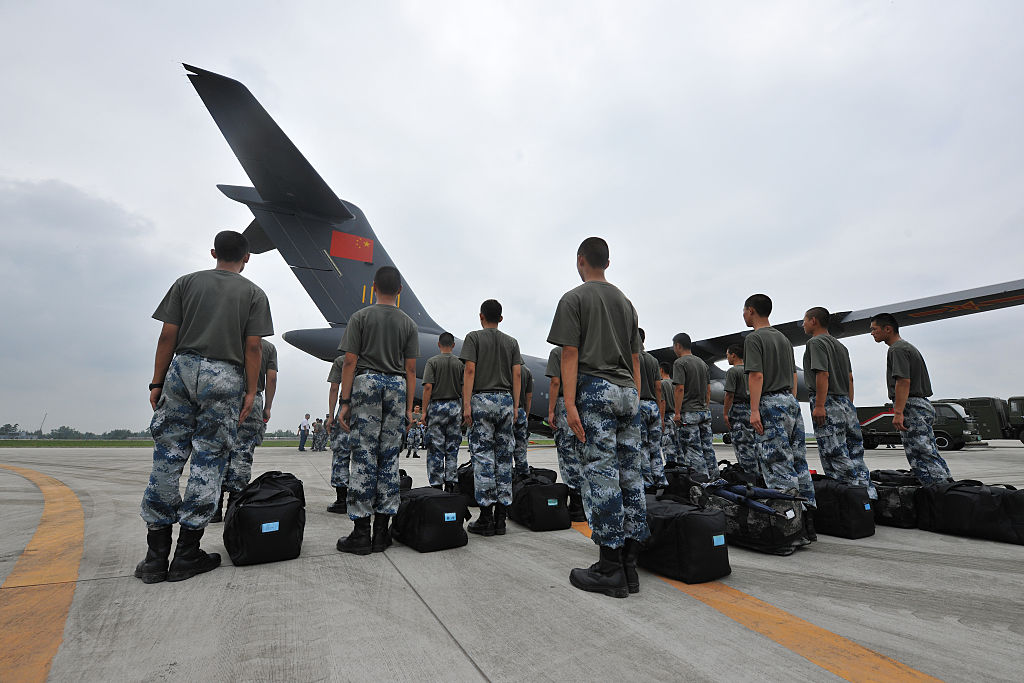 soldiers-line-beside-large-military-transport-aircraft-xian-y20-at-an-picture-id545477850