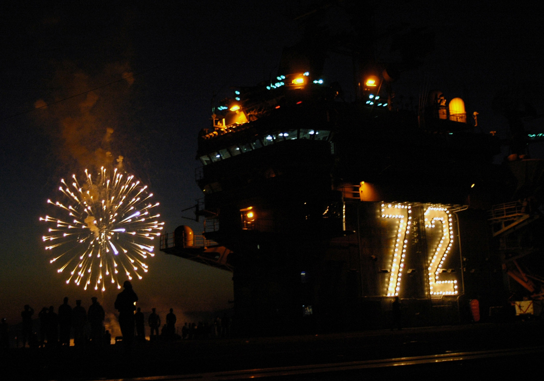 US_Navy_070704-N-5837R-016_Sailors%2C_friends_and_family_watch_Naval_Station_Everett%27s_Fourth_of_July_fireworks_display_from_the_flight_deck_of_Nimitz-Class_aircraft_carrier_USS_Abraham_Lincoln_%28CVN_72%29.jpg