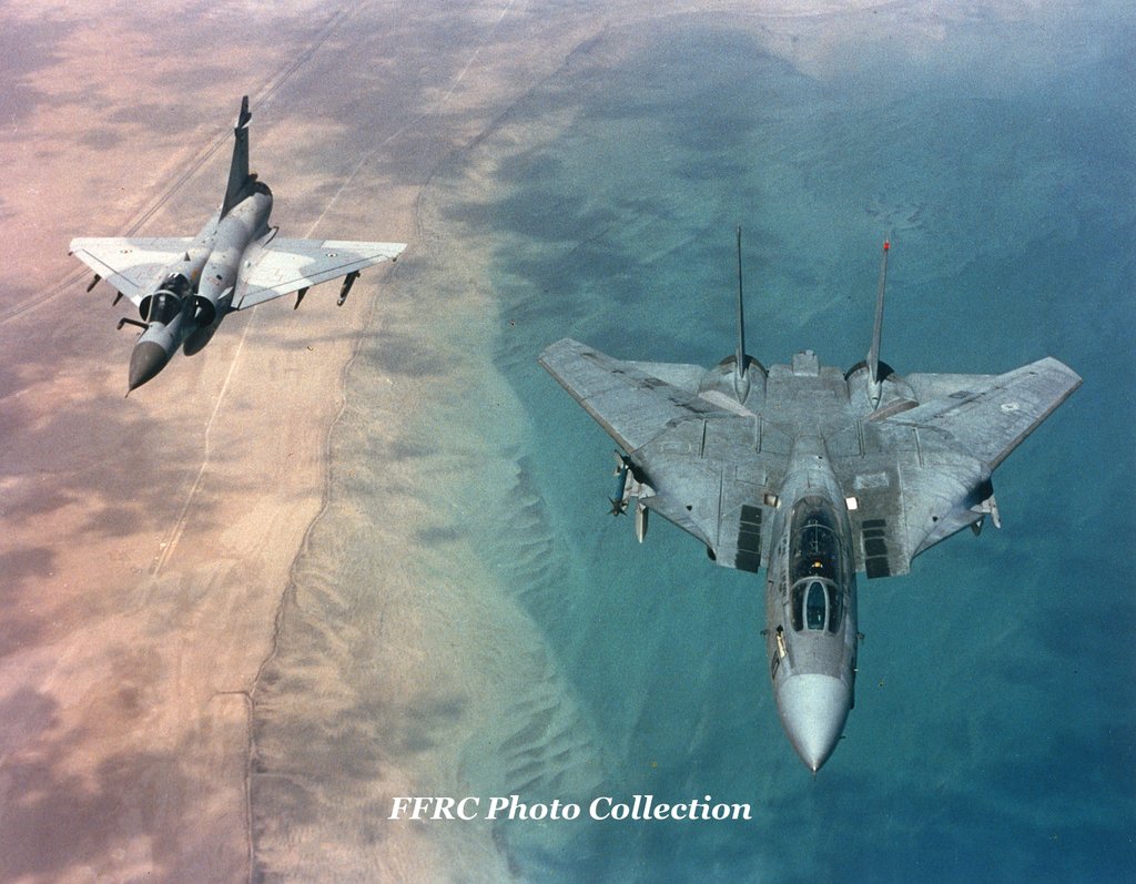 f_14a_vf_213_flying_alongside_a_uae_mirage_2000_by_fighterman35-dbcremj.jpg
