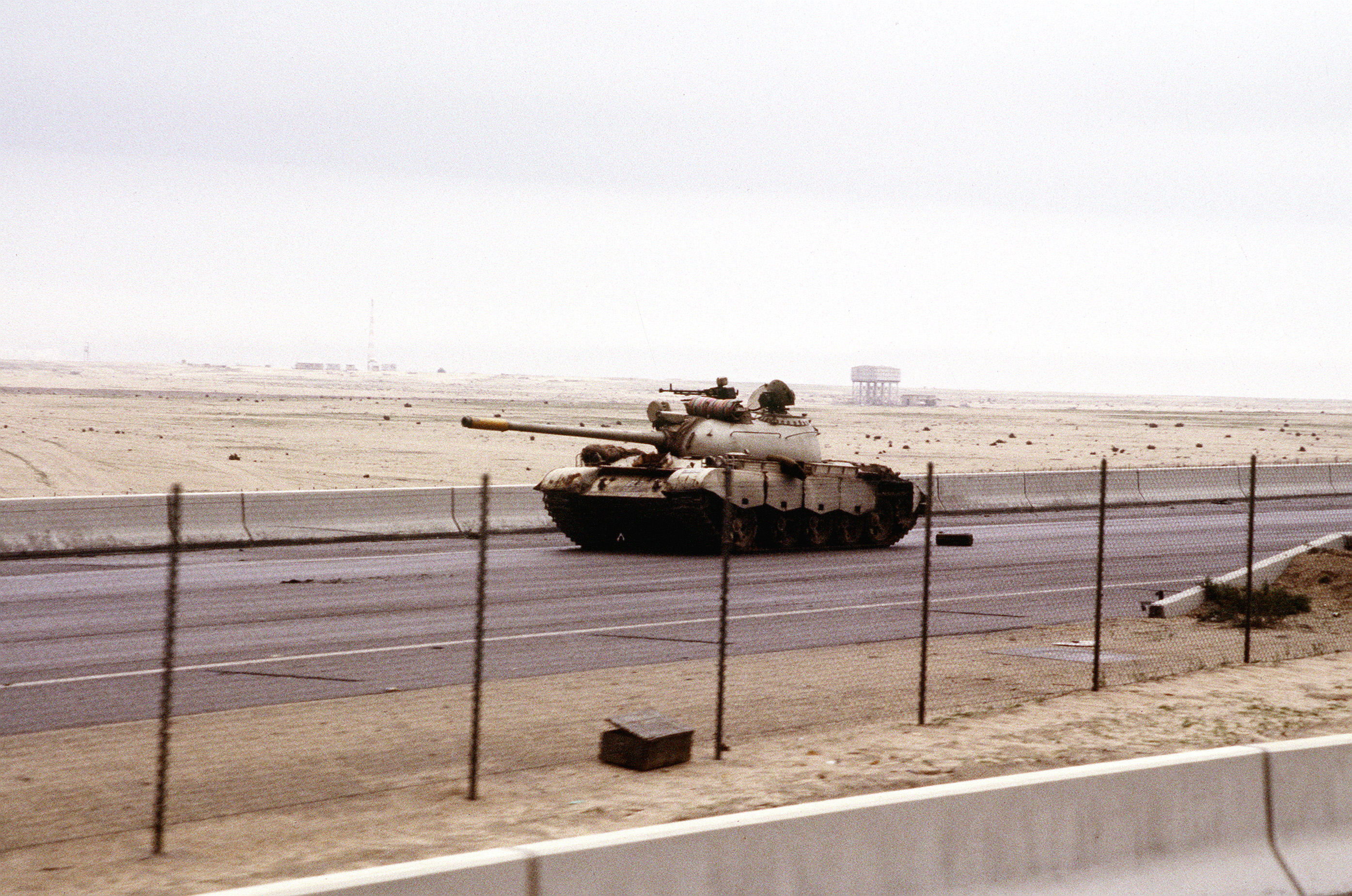 An-abandoned-Iraqi-Type-69-tank-on-the-road-into-Kuwait-City-during-the-Gulf-War.jpeg
