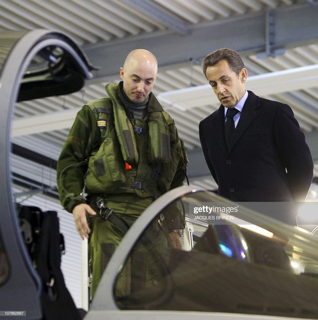 french-president-nicolas-sarkozy-listens-to-a-military-instructor-as-picture-id107862887