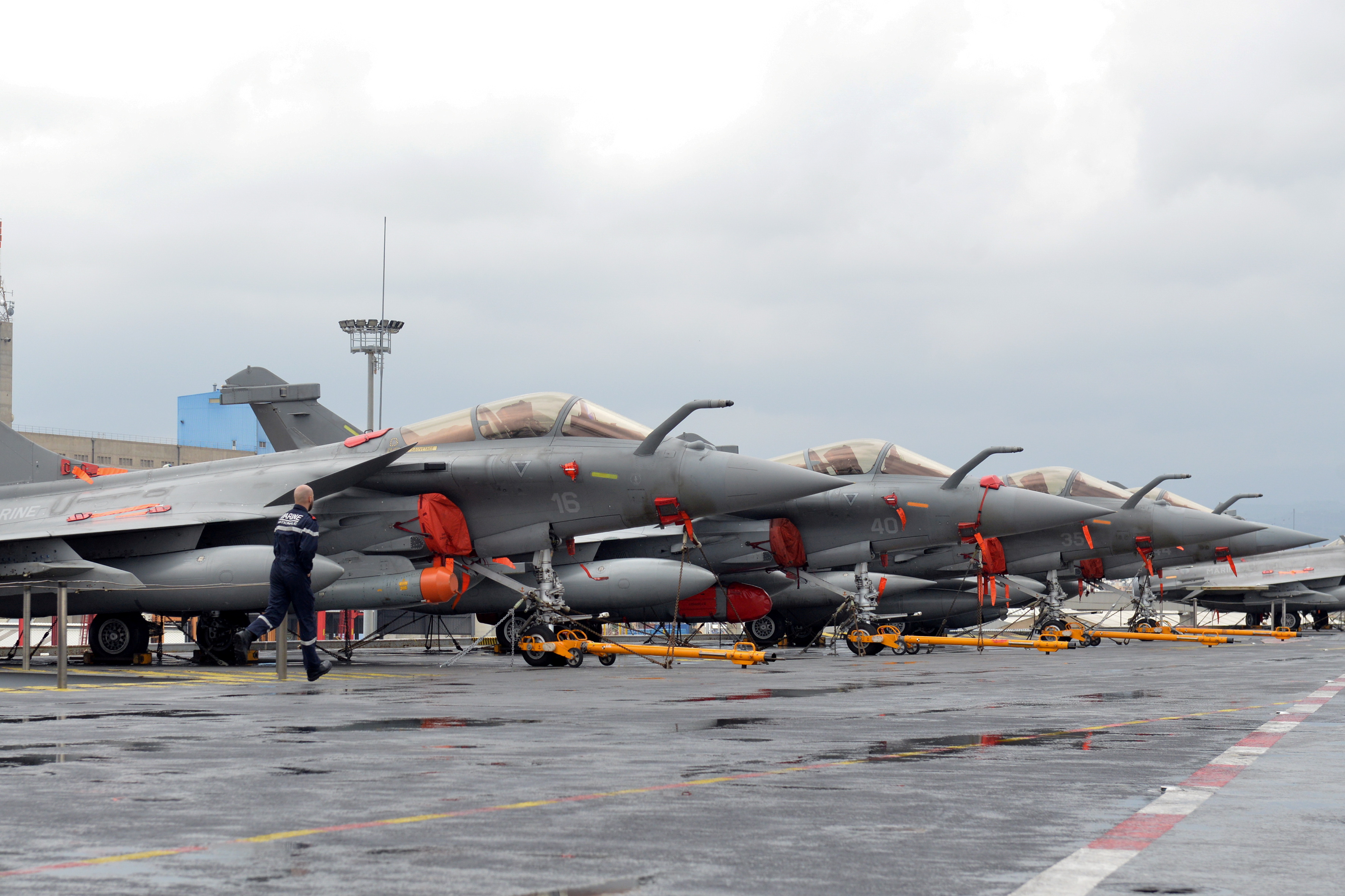 French Navy Rafale fighter jets are seen onboard the Charles de Gaulle aircraft carrier, currently moored at the port of Limassol, Cyprus February 21, 2020. REUTERS/Stefanos Kouratzis/File Photo