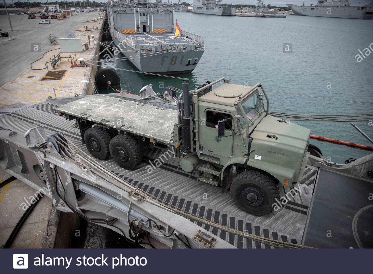 191214-n-pe825-0007-rota-spain-dec-14-2019-a-seabee-assigned-to-naval-mobile-construction-battalion-nmcb-11-drives-a-medium-tactical-vehicle-replacement-truck-aboard-the-spearhead-class-expeditionary-fast-transport-ship-usns-yuma-t-epf-8-during-the-battalions-mount-out-exercise-mox-an-mox-simulates-the-battalions-ability-to-deploy-their-89-person-air-detachment-within-48-hours-to-support-missions-required-by-a-supported-commander-nmcb-11-is-currently-forward-deployed-to-rota-spain-in-support-of-commander-task-force-ctf-68-to-provide-expeditionary-construction-and-engin-2AFXWEN.jpg