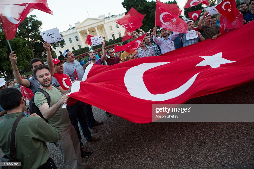 group-gathers-in-front-of-the-white-house-to-protest-the-coup-in-on-picture-id576527394
