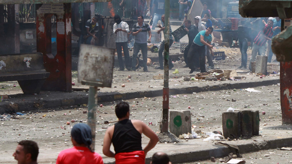 120502211154_unidentified_egyptians_top_throw_stones_at_anti-military_protesters__976x549_afp_nocredit.jpg