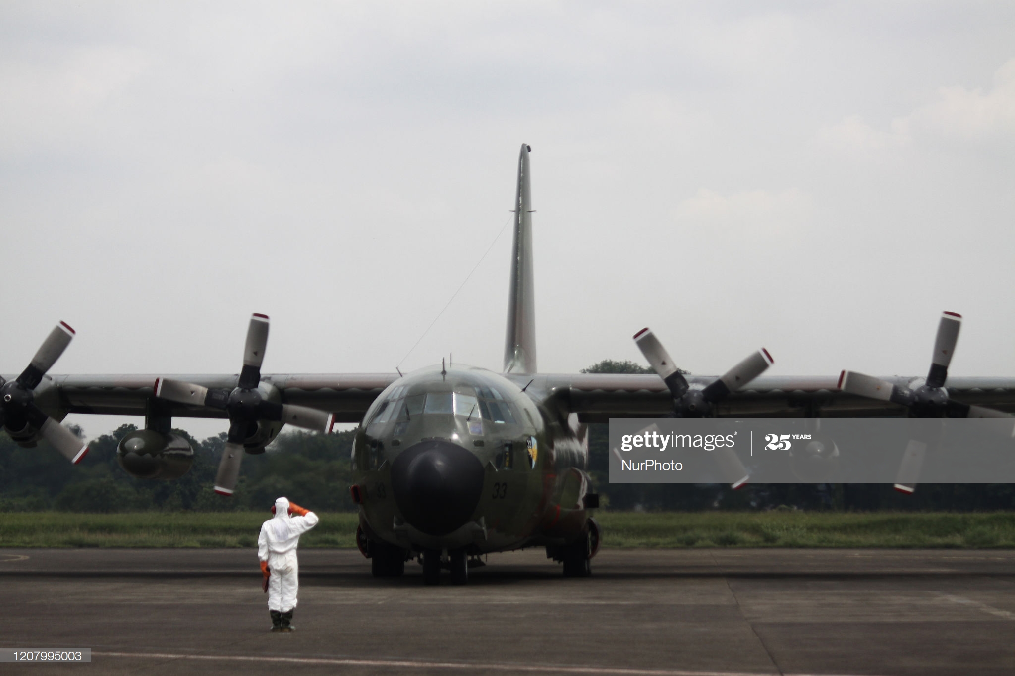 military-aircraft-of-indonesian-air-force-which-carrying-9-tons-of-picture-id1207995003