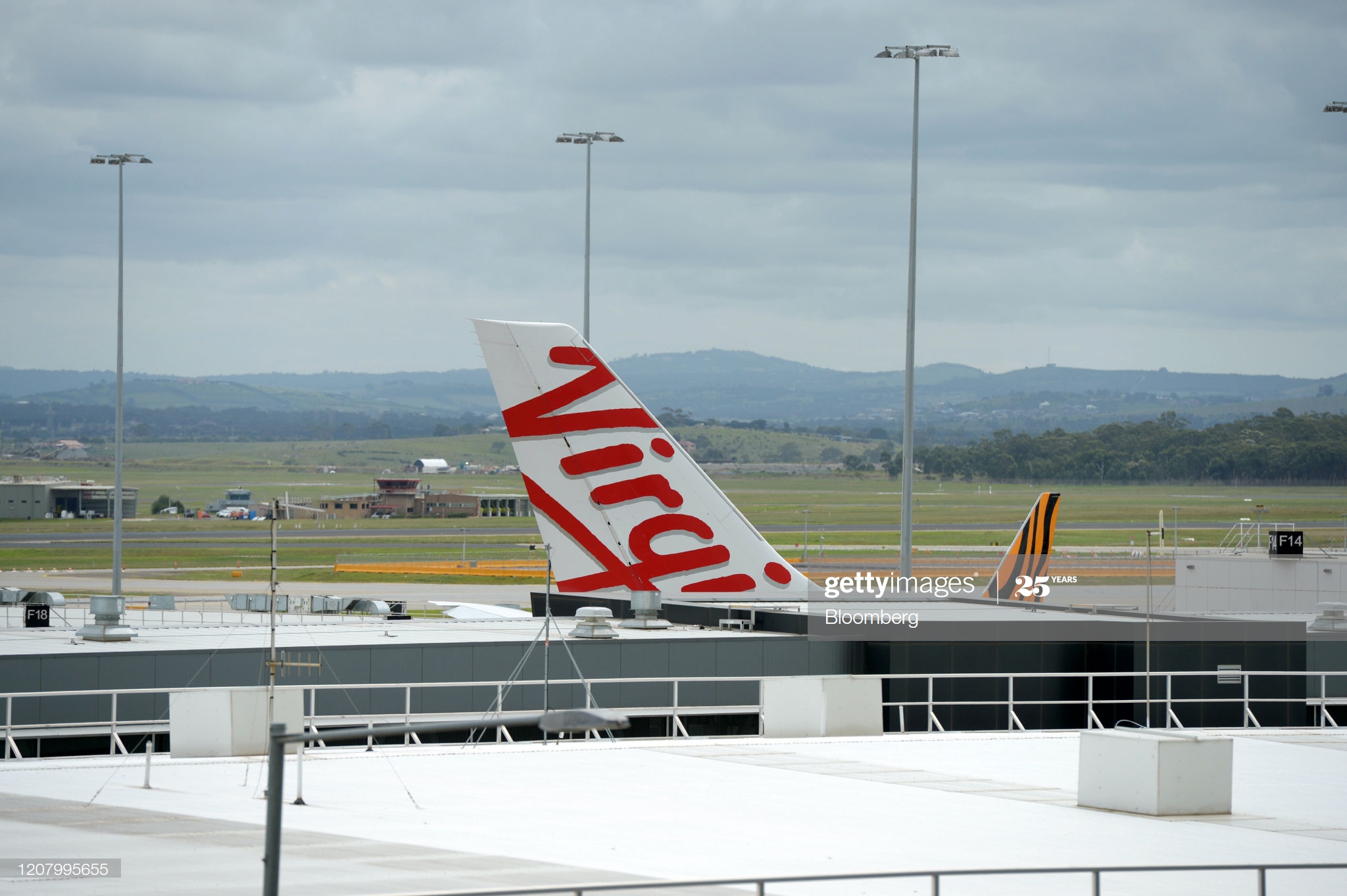 passenger-aircraft-operated-by-virgin-australia-holdings-ltd-left-and-picture-id1207995655