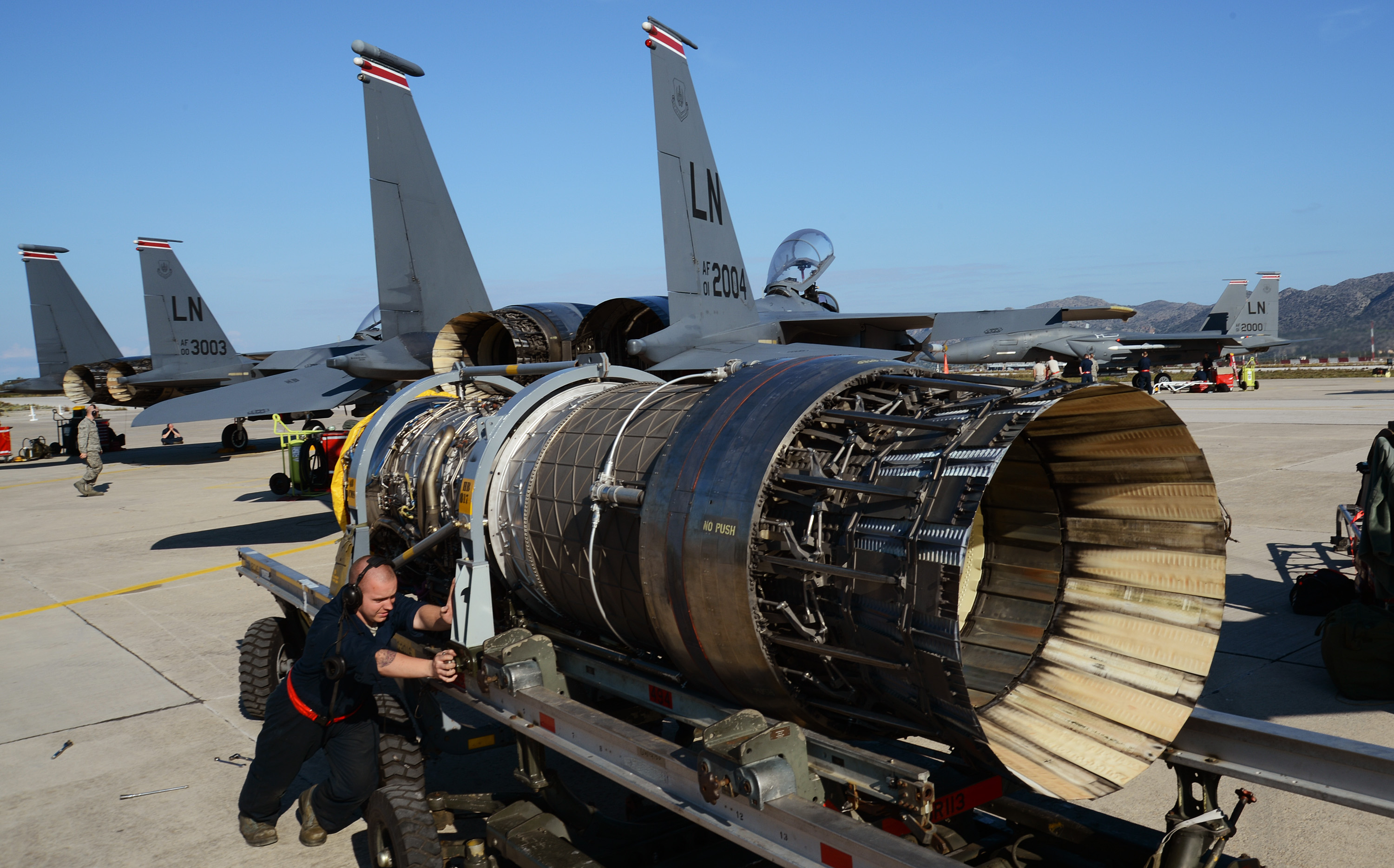 U.S._Air_Force_Senior_Airman_Christopher_Strader,_a_maintainer_with_the_494th_Expeditionary_Fighter_Squadron,_prepares_an_engine_for_replacement_into_an_F-15E_Strike_Eagle_aircraft_at_Souda_Air_Base,_Greece_140227-F-MY082-094.jpg
