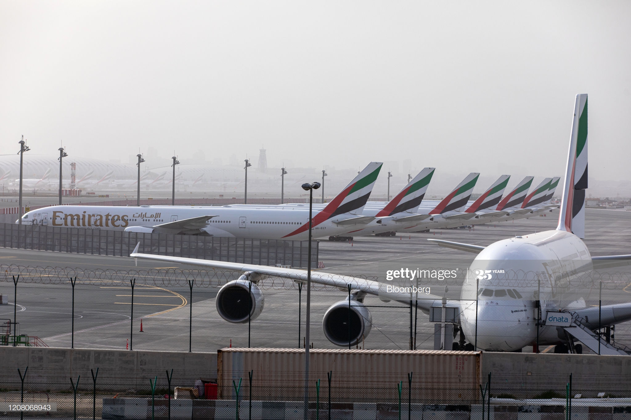 an-airbus-se-a380800-right-and-a-line-of-boeing-co-777300-aircraft-picture-id1208068943