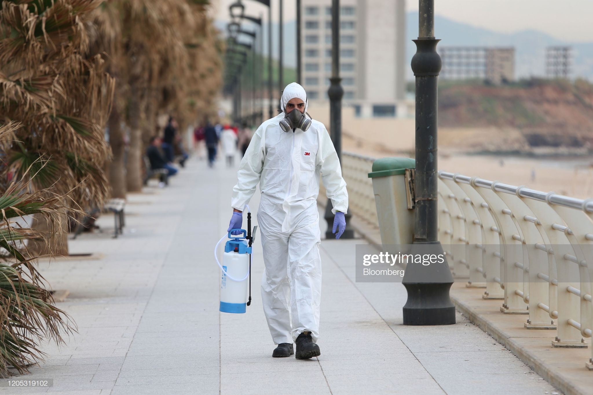 cleaning-company-worker-carries-disinfectant-to-protect-against-the-picture-id1205319102