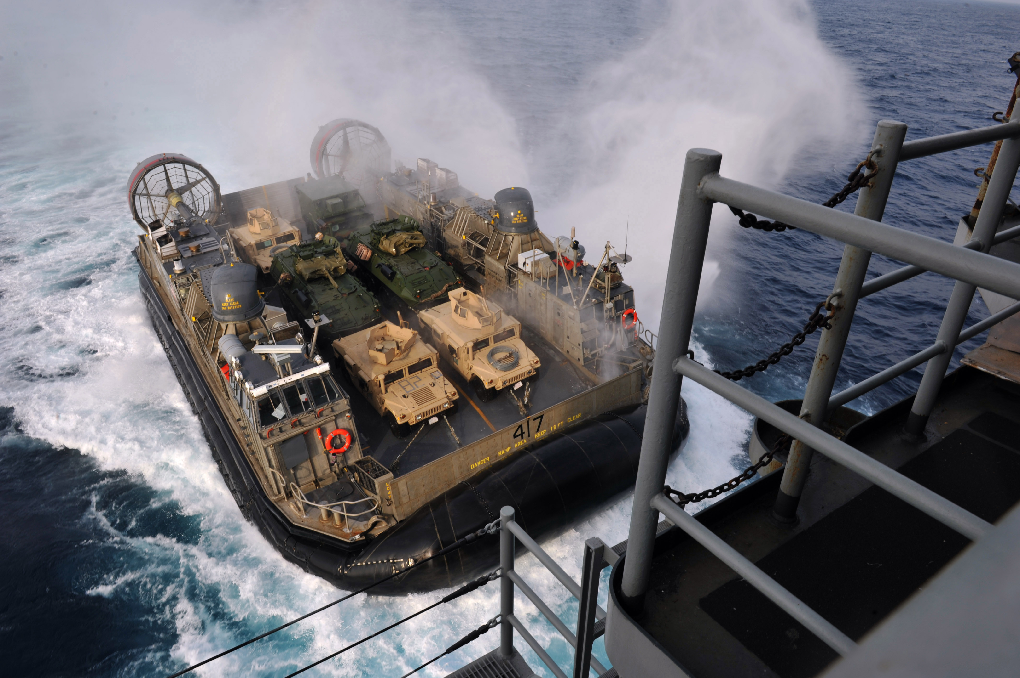 A_U.S._Navy_Landing_Craft_Air_Cushion,_more_commonly_known_as_an_LCAC,_approaches_the_well_deck_of_the_amphibious_assault_ship_USS_Bonhomme_Richard_(LHD_6)_as_the_ship_operates_in_the_East_China_Sea_on_Feb_130202-N-VA915-096.jpg
