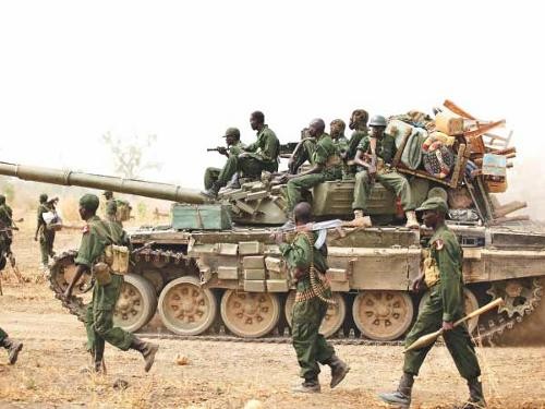south-sudanese-soldiers-walk-alongside-tank-they-withdraw-town-jau-disputed-border-sudan.jpg
