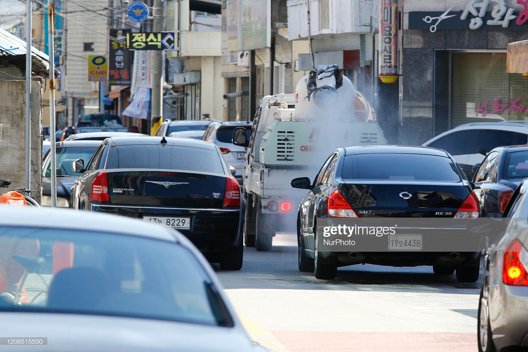 local-government-vehicle-desinfection-to-district-at-downtowns-sangju-picture-id1206515550