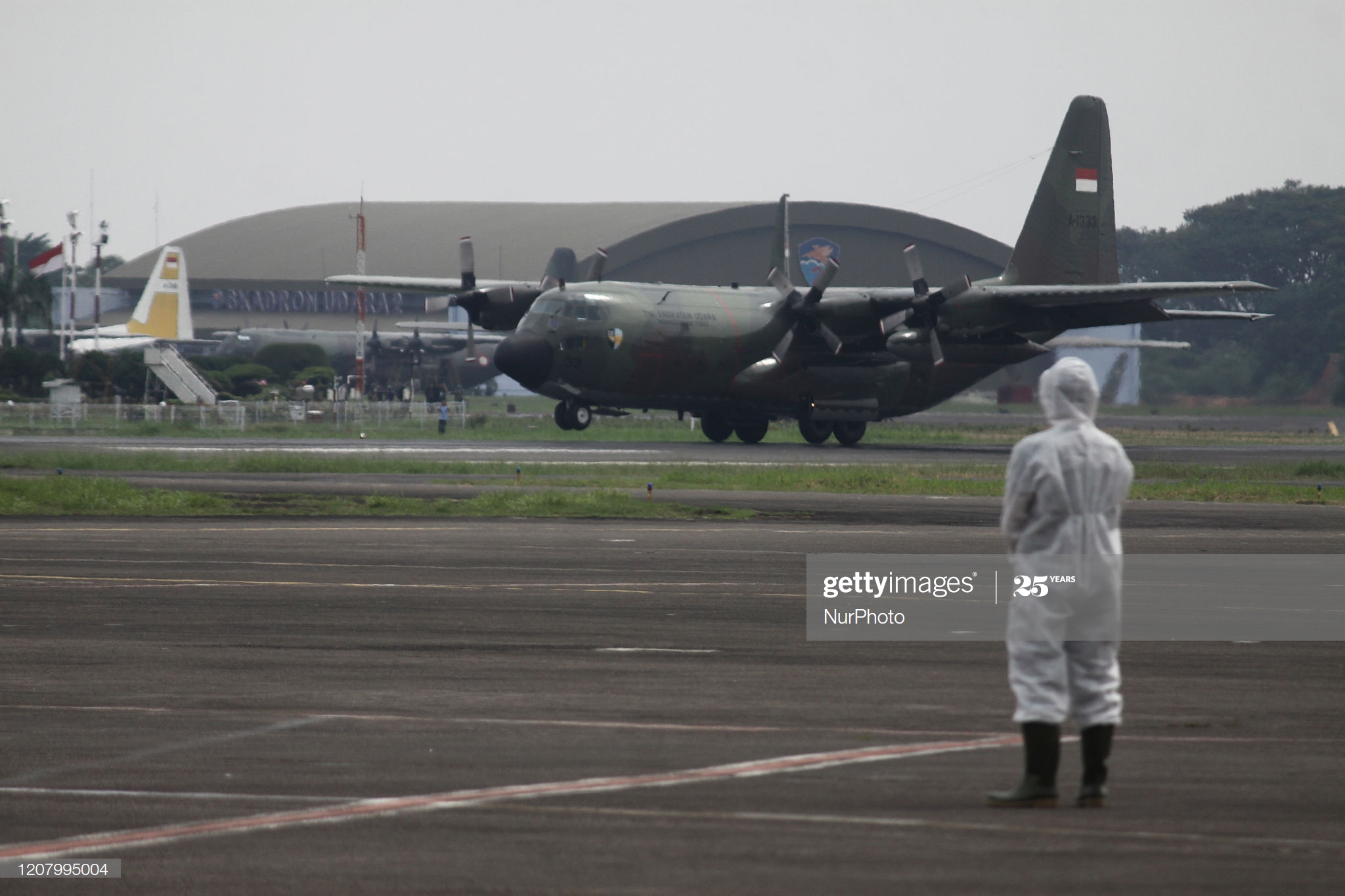 military-aircraft-of-indonesian-air-force-which-carrying-9-tons-of-picture-id1207995004