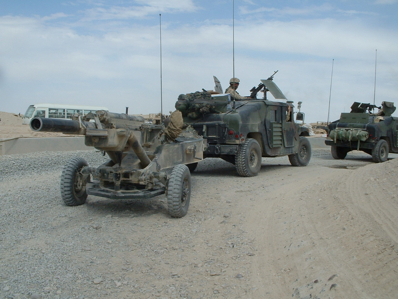 M1114_towing_M102_Howitzer.JPG