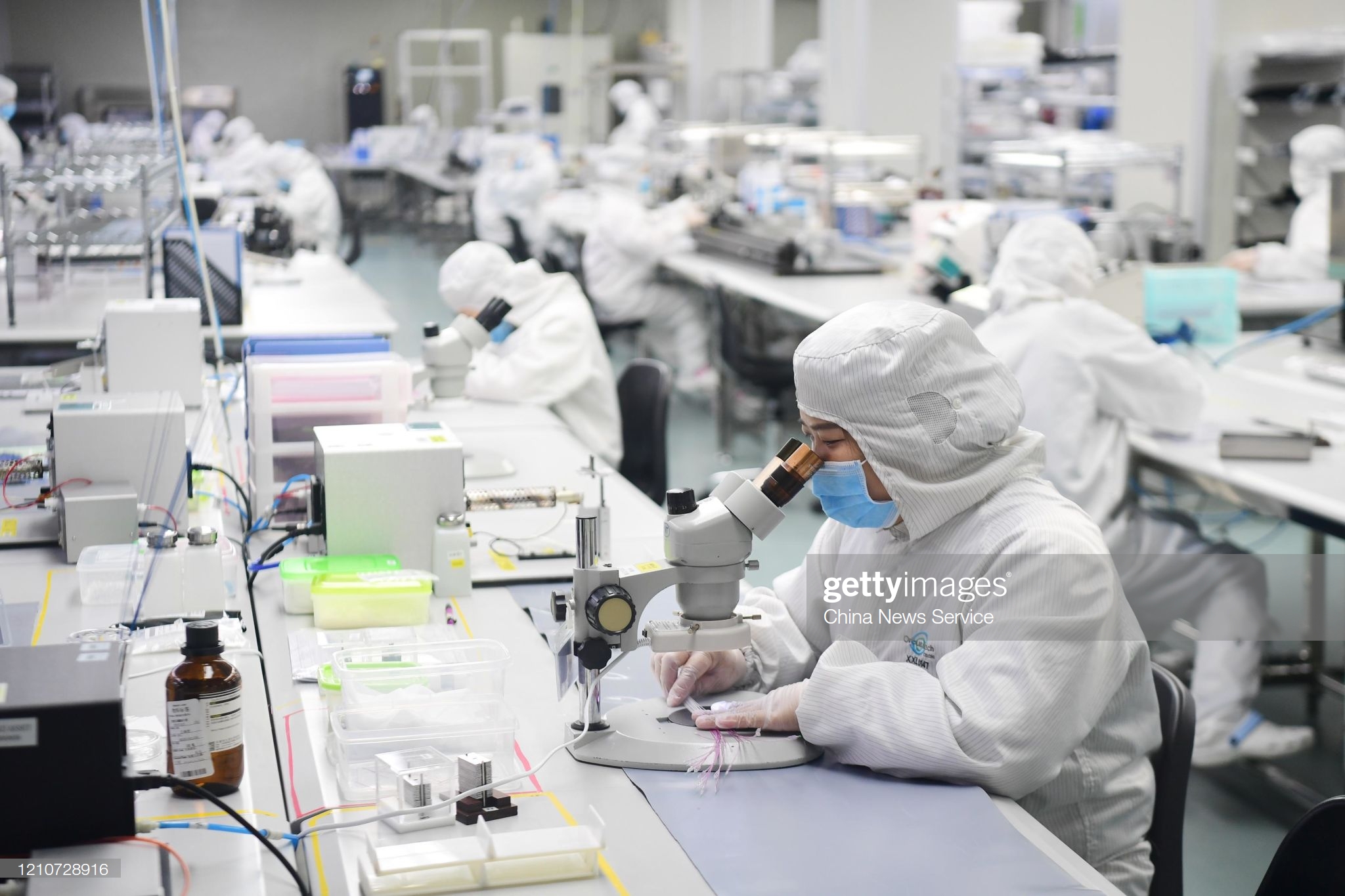 employees-wearing-protective-suits-work-at-orbusneich-medical-co-ltd-picture-id1210728916