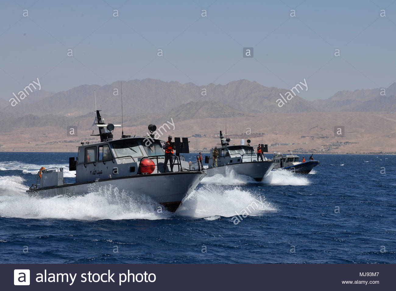 aqaba-jordan-april-22-2018-three-royal-jordanian-patrol-boats-align-during-a-bi-lateral-boat-maneuvering-exercise-with-coastal-riverine-squadron-4-and-royal-jordanian-navy-combat-boats-group-during-eager-lion-april-22-2018-eager-lion-is-a-capstone-training-engagement-that-provides-us-forces-and-the-jordan-armed-forces-an-opportunity-to-rehearse-operating-in-a-coalition-environment-and-to-pursue-new-ways-to-collectively-address-threats-to-regional-security-and-improve-overall-maritime-security-us-navy-photo-by-mass-communication-specialist-1st-class-sandi-grimnes-morenorelea-MJ93M7.jpg
