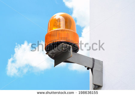 stock-photo-revolving-amber-light-beacon-or-siren-at-corner-of-building-198636155.jpg