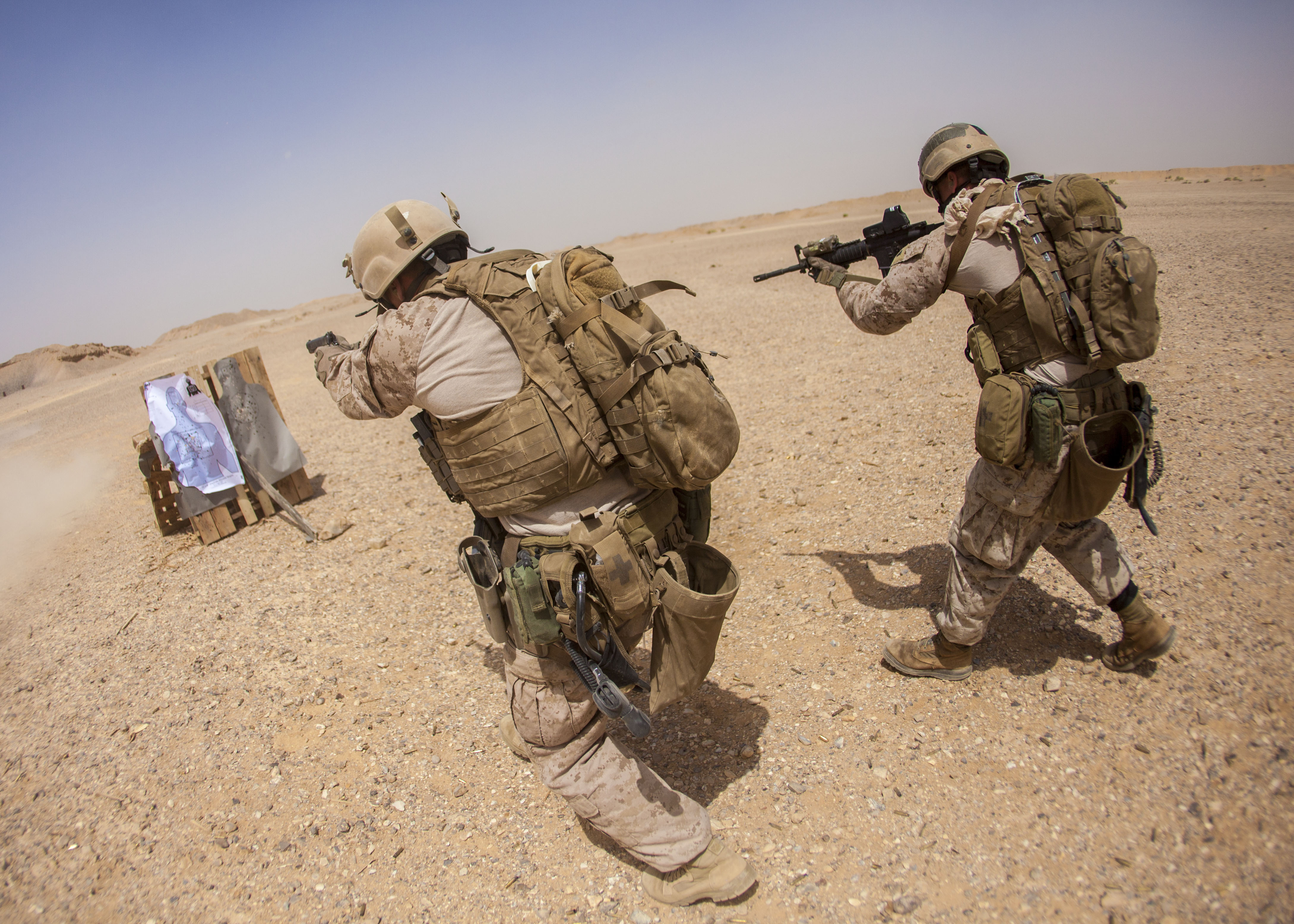 U.S._Marines_with_the_26th_Marine_Expeditionary_Unit's_maritime_raid_force_fire_an_M4_carbine_and_an_M1911_.45-caliber_pistol_at_a_range_in_Jordan_June_9,_2013,_during_exercise_Eager_Lion_2013_130609-M-SO289-022.jpg