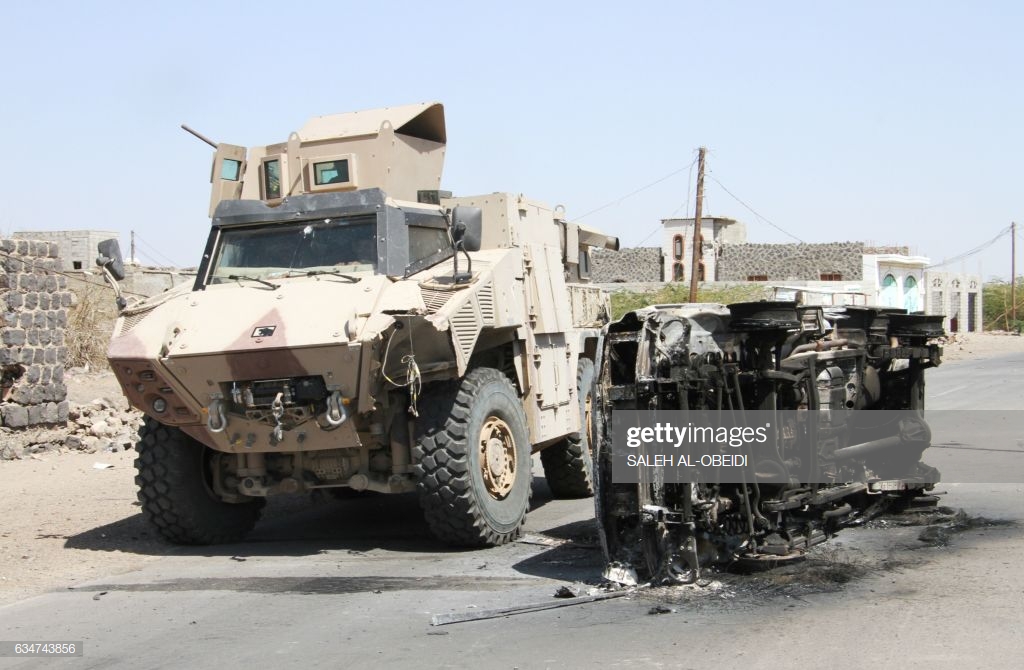 fighters-loyal-to-the-saudibacked-yemeni-president-drive-an-armoured-picture-id634743856