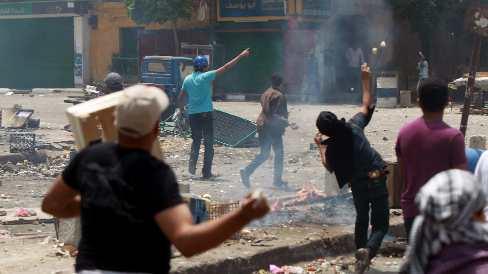120502215134_egyptian_anti-military_protesters_throw_stones_during_clashes_with_unidentified_attackers_in_the_abbassiya_district_of_cairo__976x549_afp_nocredit.jpg