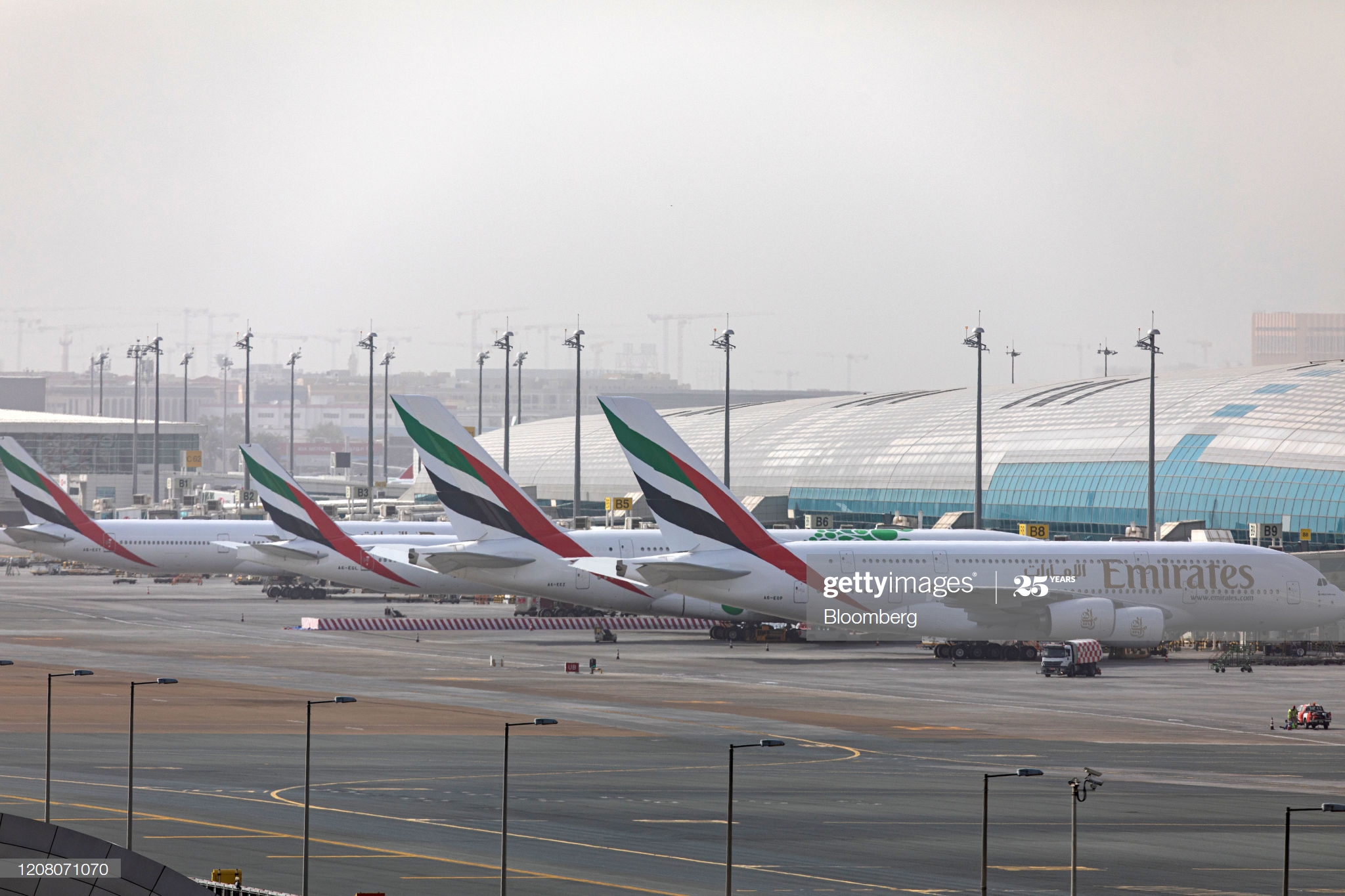 an-airbus-se-a380800-aircraft-right-stands-alongside-a-line-of-boeing-picture-id1208071070