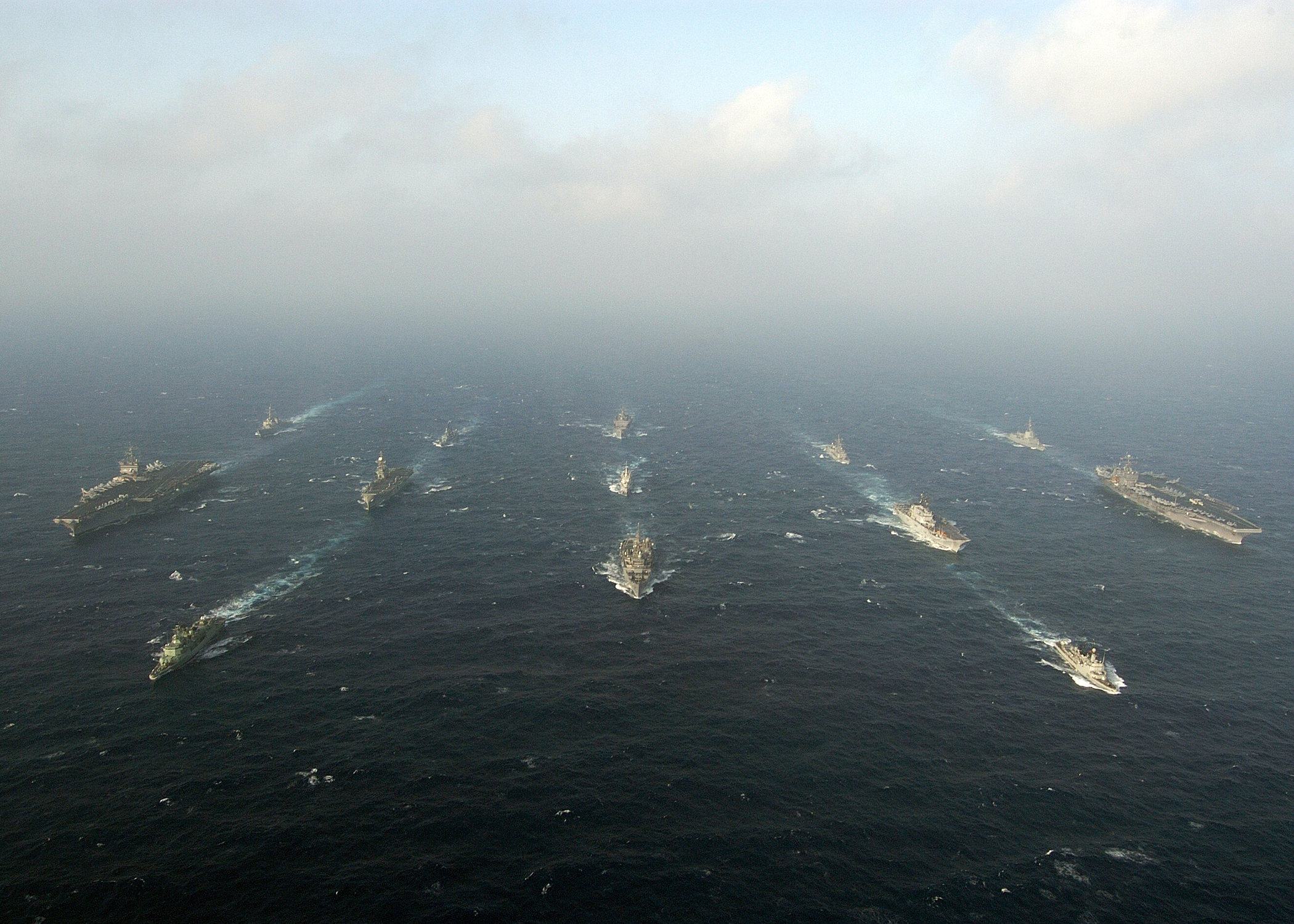 US_Navy_040712-N-5405H-101_USS_Enterprise_(CVN_65),_left,_and_USS_Harry_S._Truman_(CVN_75),_right,_steam_through_the_waters_of_the_Atlantic_Ocean_in_formation_with_other_US_Navy_ships_and_multi-national_warships_as_part_of_Maje.jpg