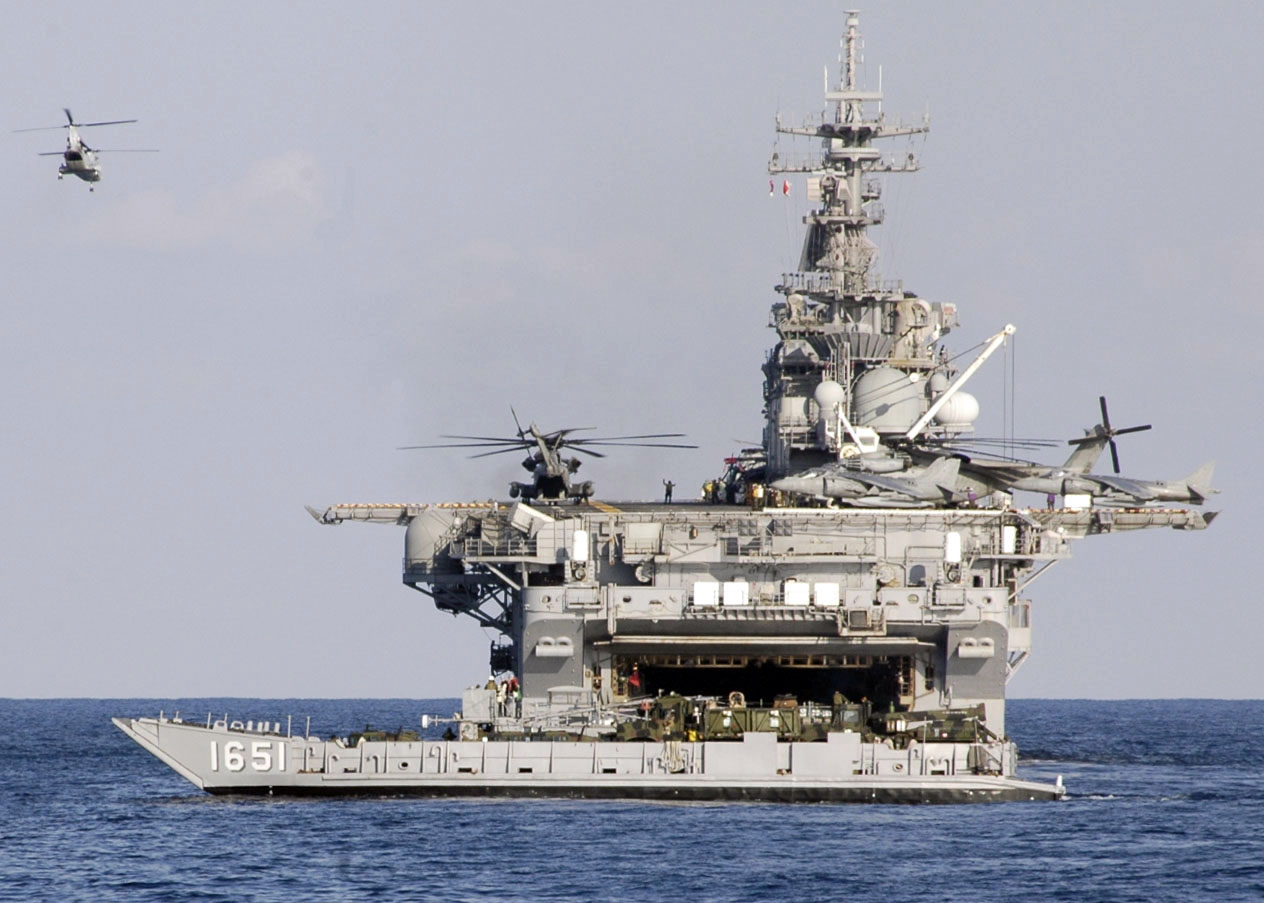 US_Navy_070205-N-6274T-046_USS_Essex_(LHD_2)_conducts_flight_quarters_while_Utility_Landing_Craft_1651_exits_the_well_deck.jpg