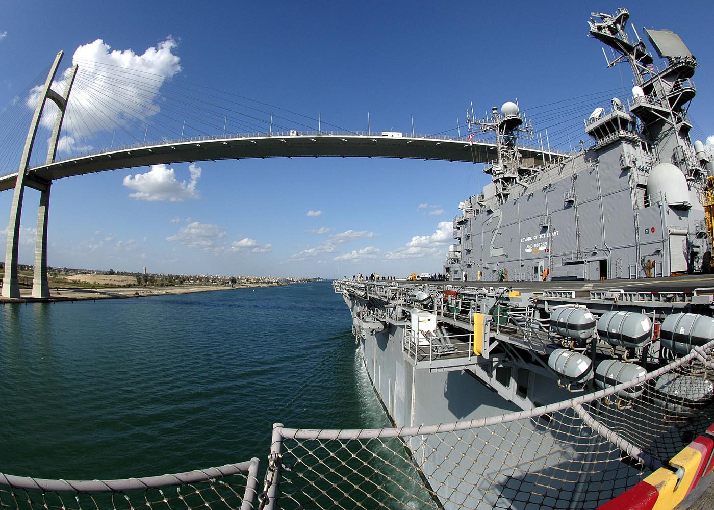 US_Navy_061204-N-8547M-034_The_amphibious_assault_ship_USS_Saipan_(LHA_2)_transits_north_in_the_Suez_Canal_after_successfully_completing_her_last_surge_deployment_before_decommissioning_in_April.jpg