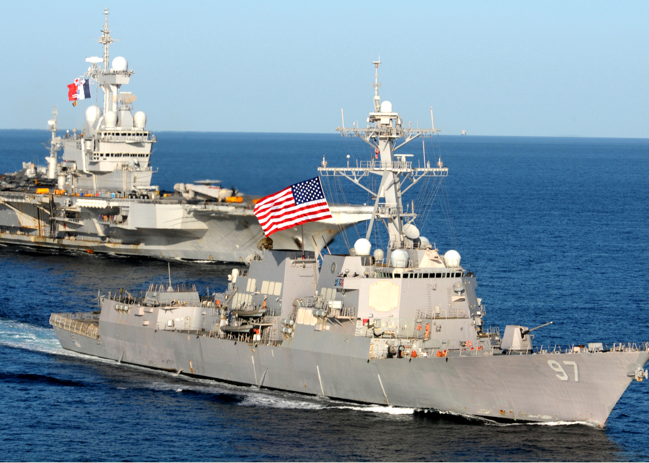 US_Navy_101210-N-8824M-268_USS_Halsey_(DDG_97)_assigned_to_Abraham_Lincoln_Carrier_Strike_Group,_sails_in_a_formation_with_the_French_aircraft_carr.jpg